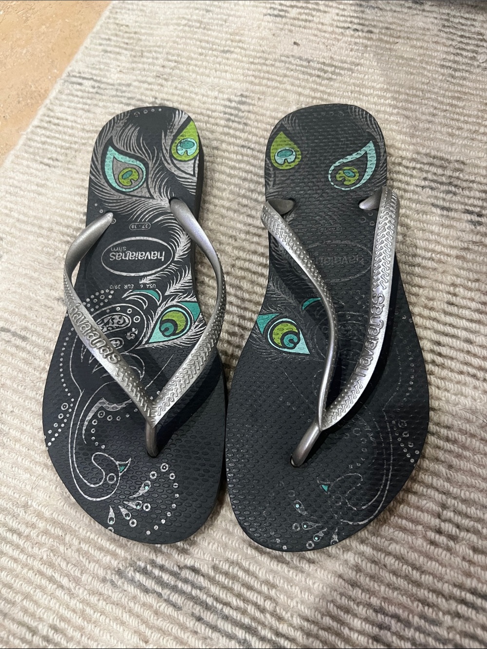 Havaianas Black Flip Flops with Green and Teal Feather Accents